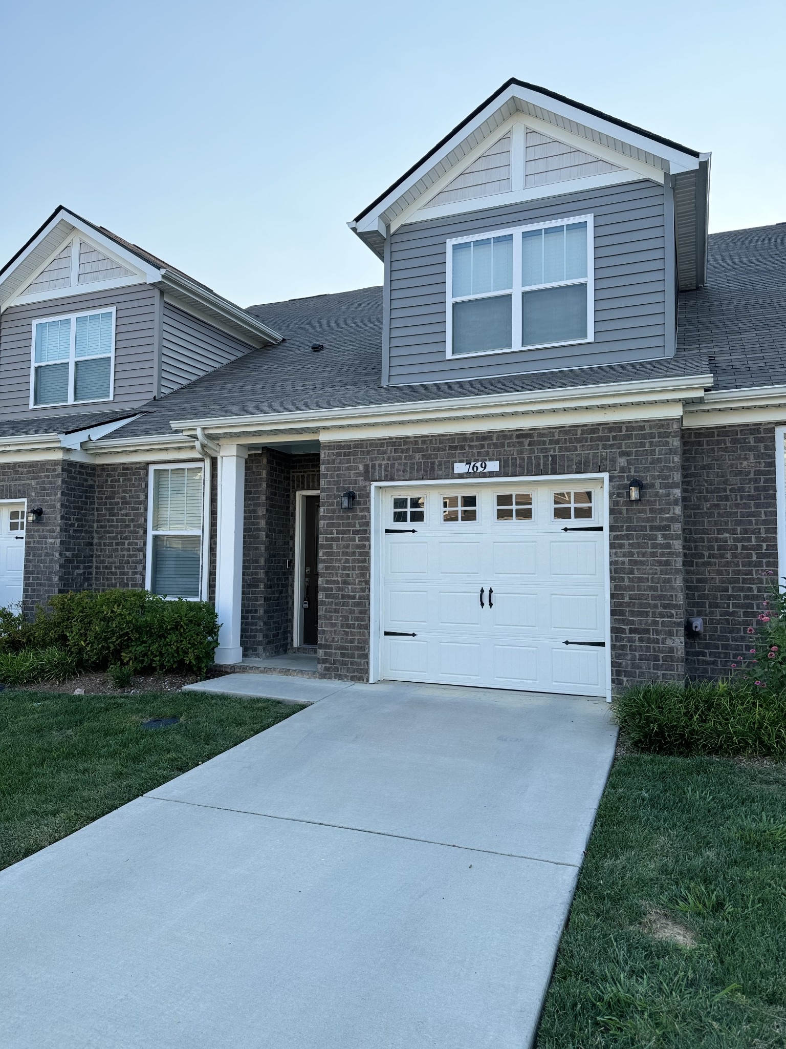 769 Mickelson Way Lebanon, TN 37087 - Photo 2 of 17 a view of a house with a yard and garage