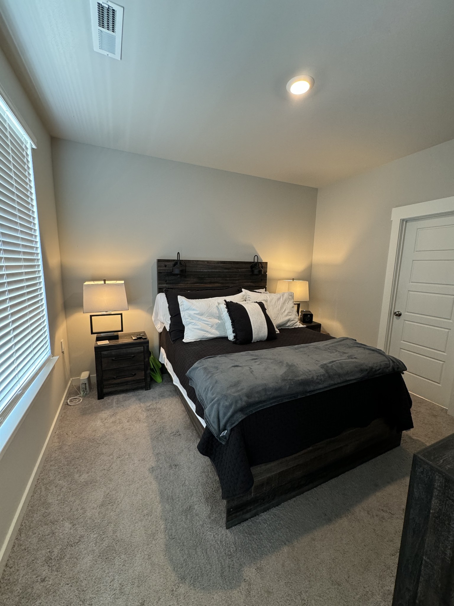 769 Mickelson Way Lebanon, TN 37087 - Photo 6 of 17 a bedroom with a bed and a lamp