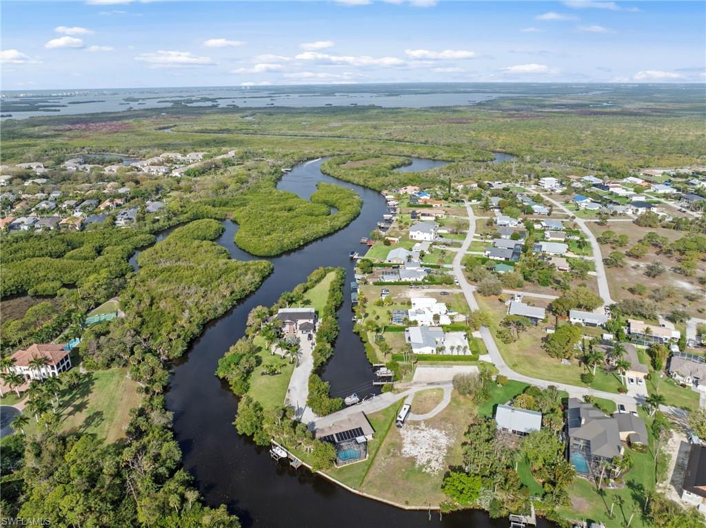 4724 Riverside Drive Estero, FL 33928 - Photo 43 of 44 a view of a lake in a city