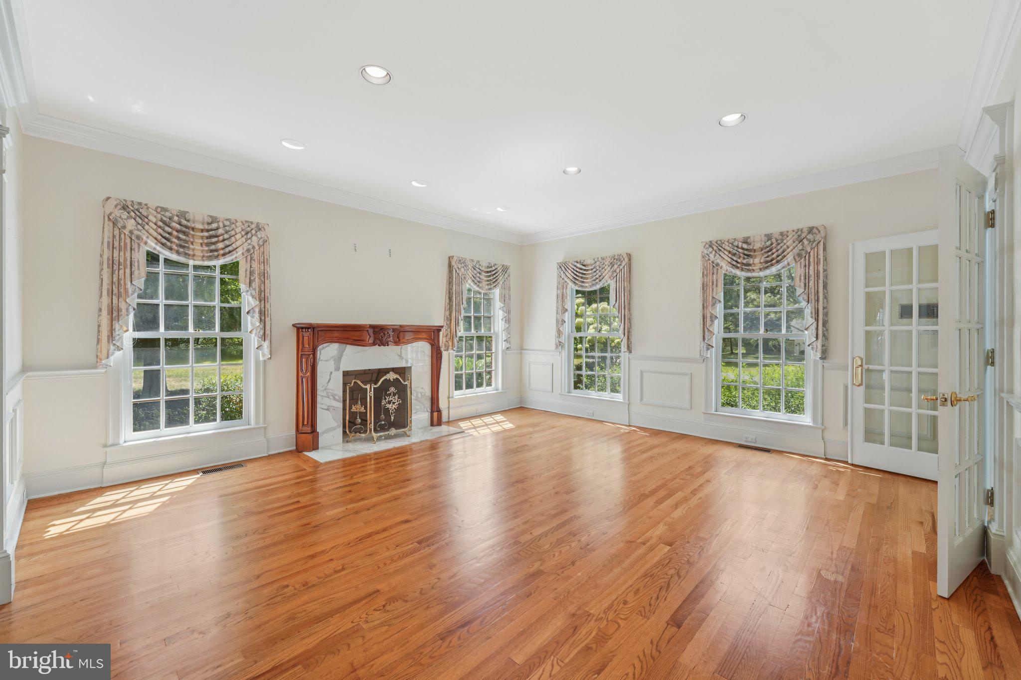 12 Paddock Drive New Hope, PA 18938 - Photo 12 of 42 a view of an empty room with wooden floor and a window