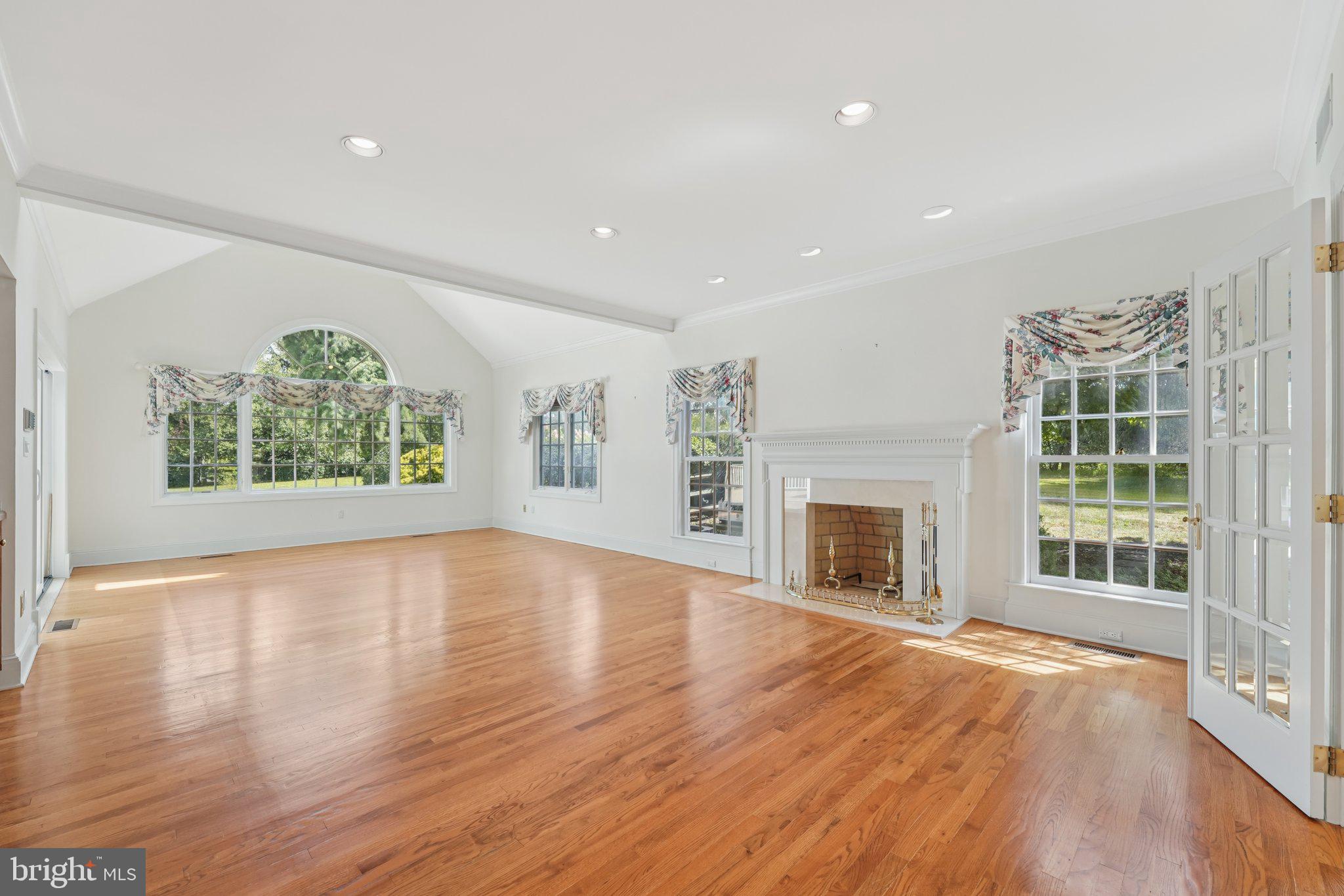 12 Paddock Drive New Hope, PA 18938 - Photo 15 of 42 an empty room with windows fire place and windows