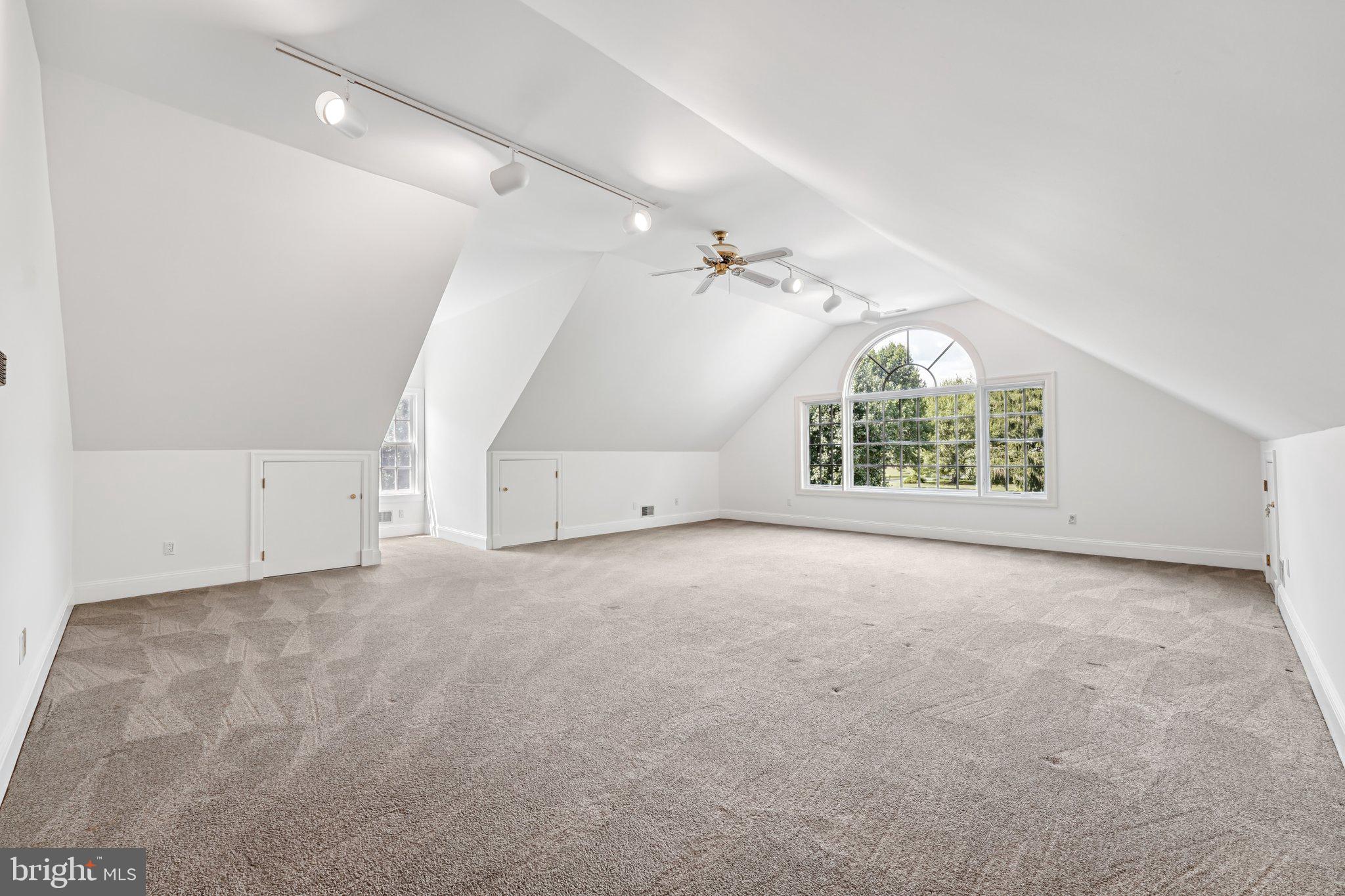 12 Paddock Drive New Hope, PA 18938 - Photo 29 of 42 an empty room with windows and pillars in it