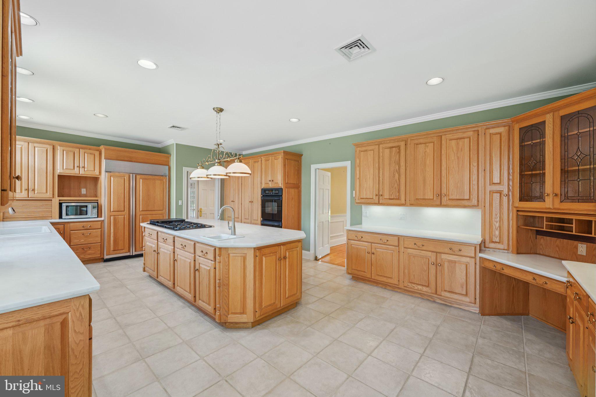 12 Paddock Drive New Hope, PA 18938 - Photo 6 of 42 a large kitchen with stainless steel appliances granite countertop a stove a sink and a refrigerator