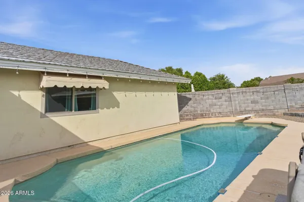 a view of a swimming pool with an outdoor space