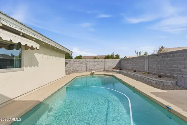 a view of a swimming pool with a terrace