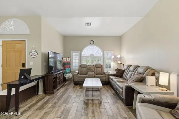 a living room with furniture fireplace and a flat screen tv