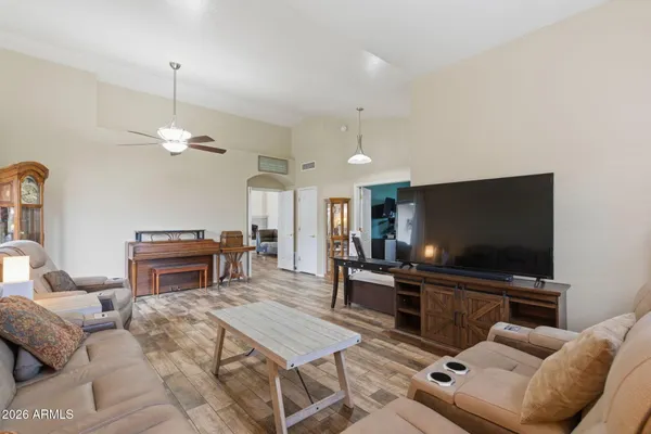 a living room with furniture and a flat screen tv
