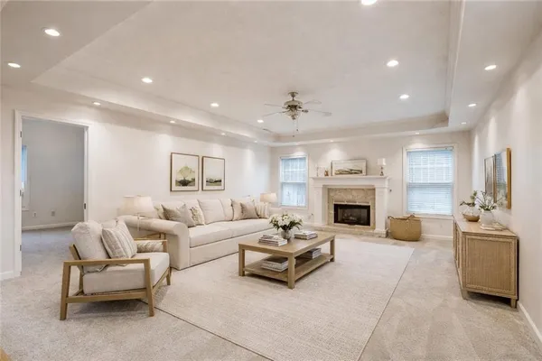 a living room with furniture and a fireplace