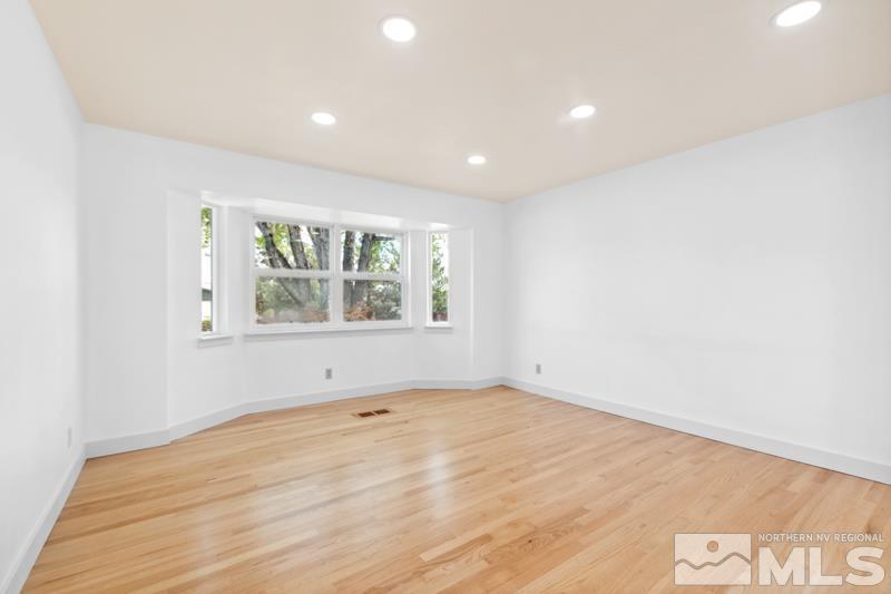 1635 Alamo Street Reno, NV 89503 - Photo 4 of 23 an empty room with wooden floor and windows