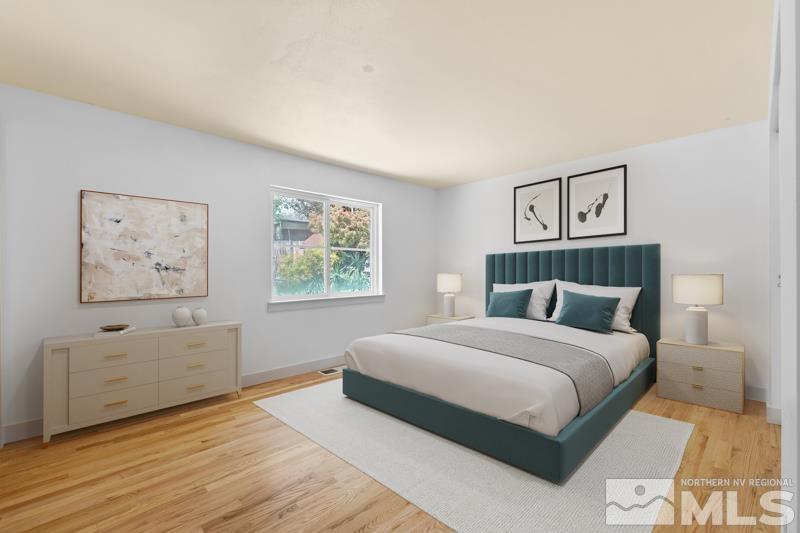 1635 Alamo Street Reno, NV 89503 - Photo 9 of 23 a bedroom with a large bed and a window