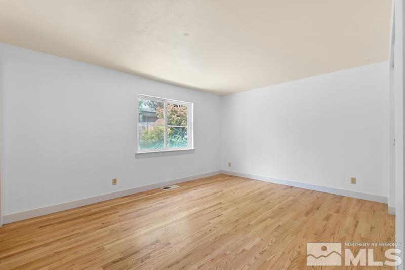 1635 Alamo Street Reno, NV 89503 - Photo 10 of 23 an empty room with wooden floor and windows