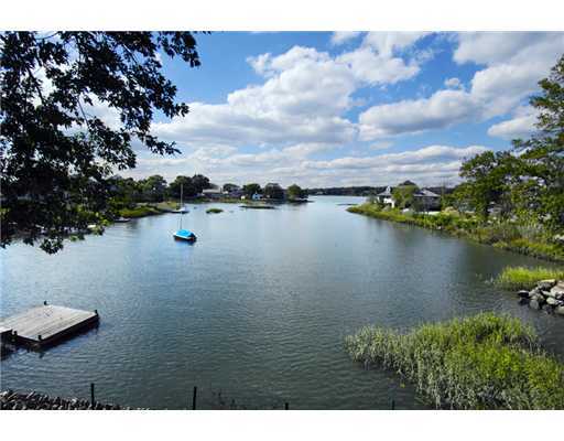 191 Shore Road Old Greenwich, CT 06870 - Photo 2 of 11 a view of lake with houses