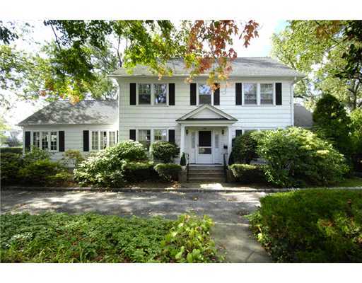 191 Shore Road Old Greenwich, CT 06870 - Photo 3 of 11 a front view of a house with a yard