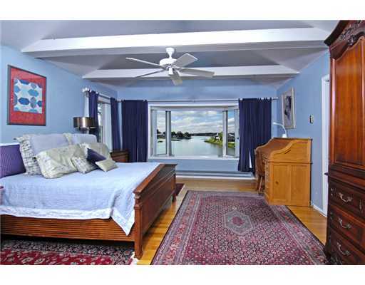 191 Shore Road Old Greenwich, CT 06870 - Photo 7 of 11 a bed room with a bed and a television
