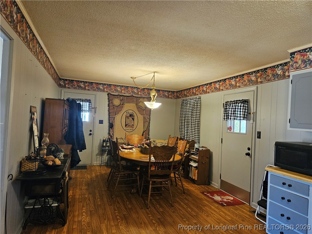 4547 Legion Road Hope Mills, NC 28348 - Photo 11 of 24 a view of a a dining room with furniture window and wooden floor