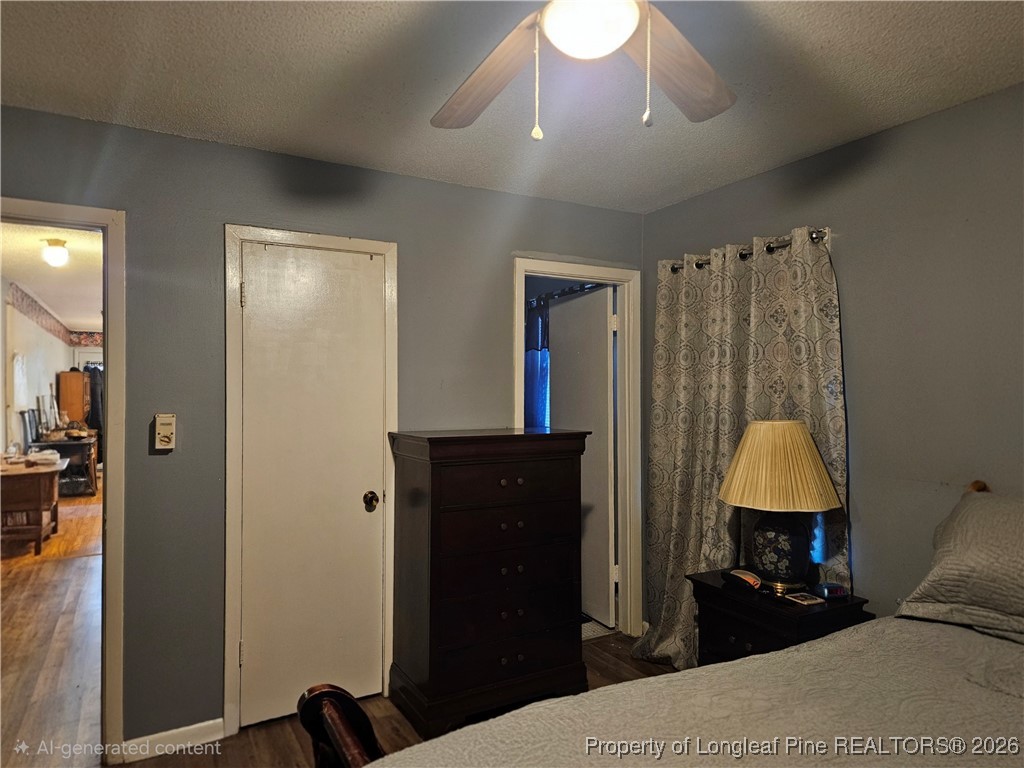 4547 Legion Road Hope Mills, NC 28348 - Photo 21 of 24 a bedroom with a bed and a closet