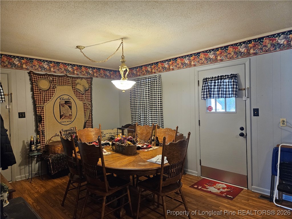 4547 Legion Road Hope Mills, NC 28348 - Photo 10 of 24 a view of a dining room with furniture and wooden floor