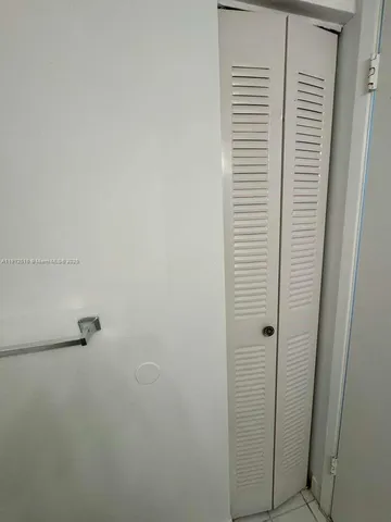 a view of swimming pool with outdoor seating and city view