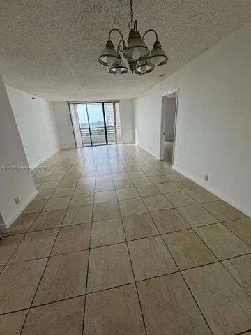 a view of an empty room with a sink