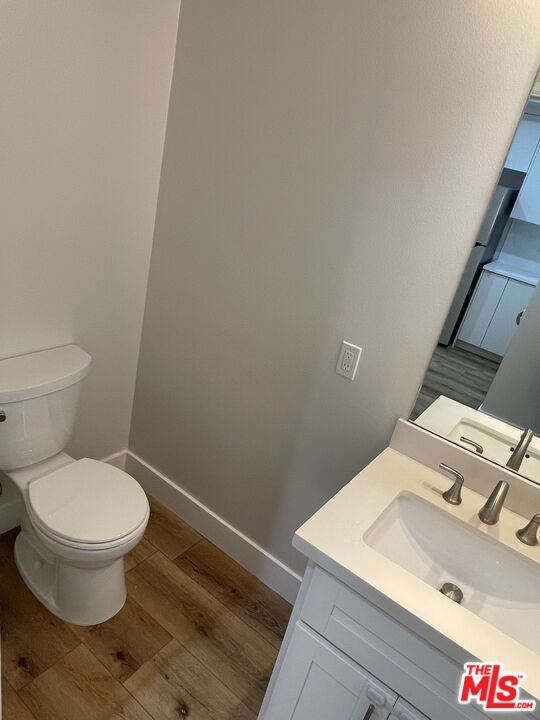 11738 Mayfield Avenue, Unit 114 Los Angeles, CA 90049 - Photo 13 of 25 a bathroom with a sink and a toilet