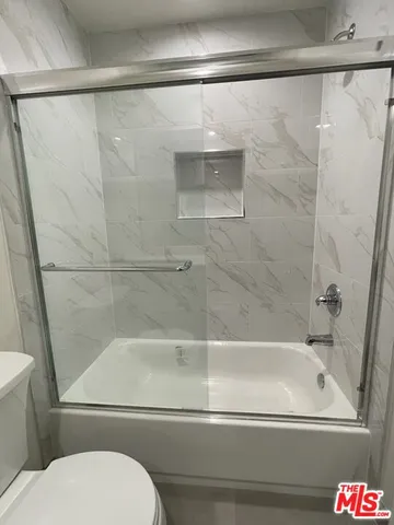 a view of a garage with cars