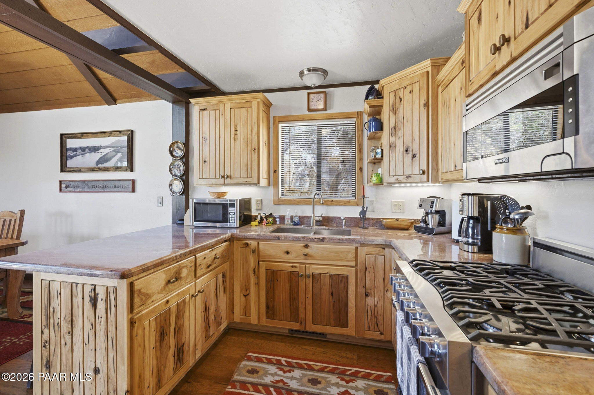 7251 South Big Bug Mesa Road Mayer, AZ 86333 - Photo 17 of 55 a kitchen with a stove a sink and a microwave