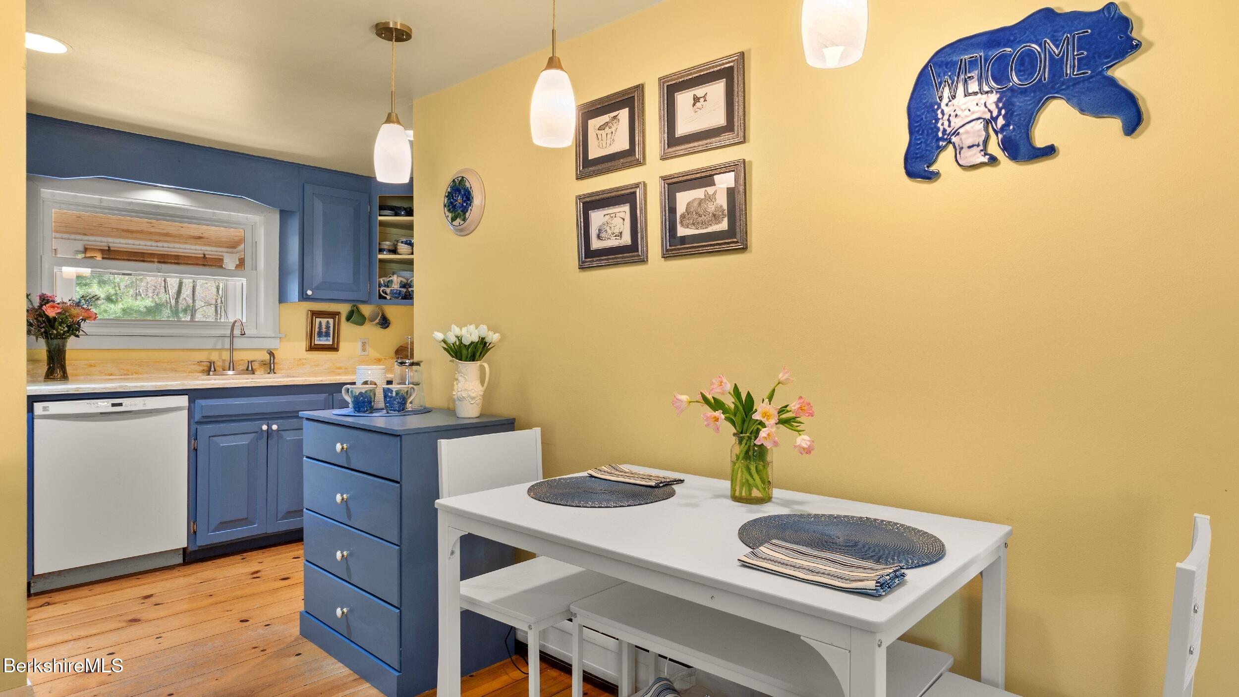 7 Lake Buel Road Great Barrington, MA 01230 - Photo 12 of 42 a kitchen with a sink cabinets and wooden floor