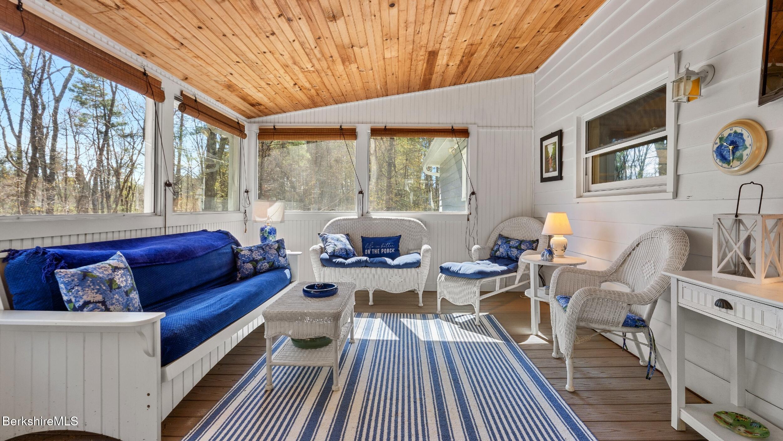 7 Lake Buel Road Great Barrington, MA 01230 - Photo 17 of 42 a living room with furniture and a large window