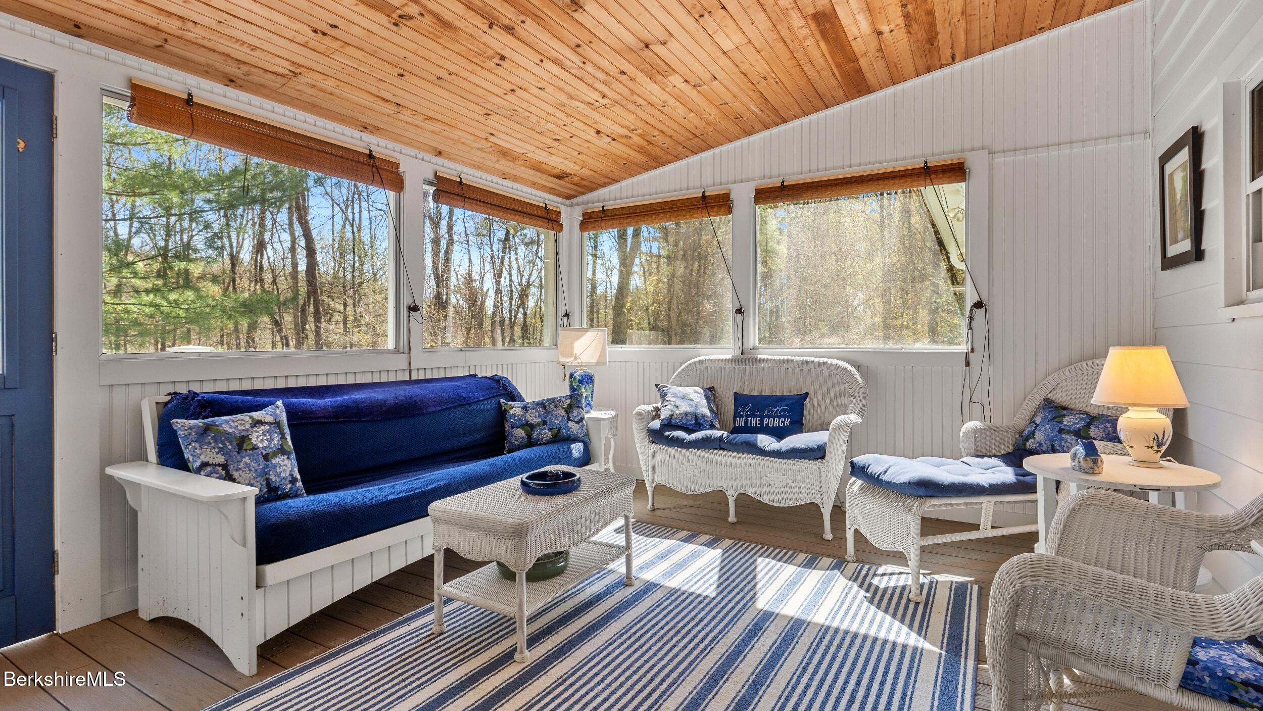 7 Lake Buel Road Great Barrington, MA 01230 - Photo 18 of 42 a living room with furniture and a large window