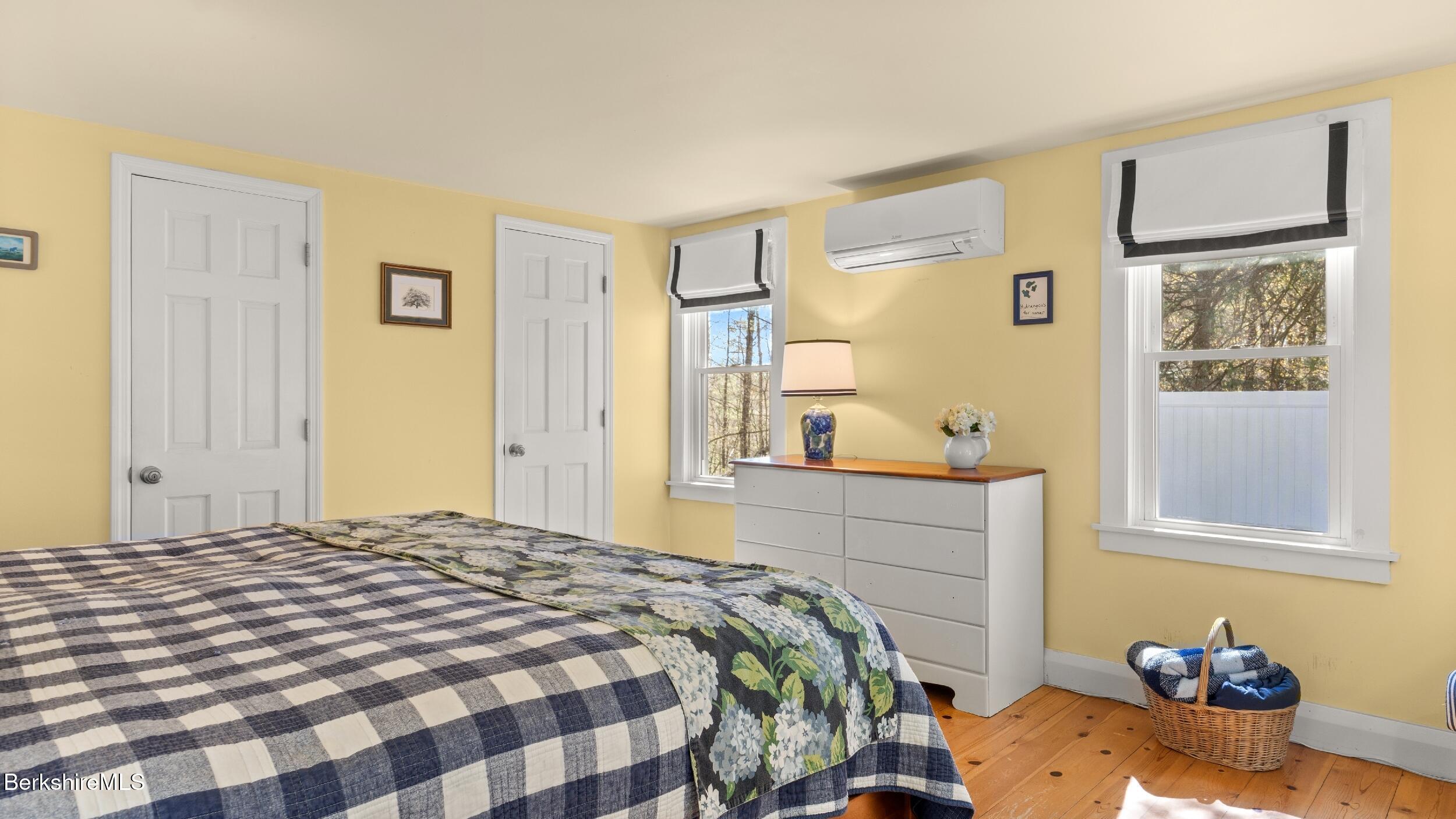 7 Lake Buel Road Great Barrington, MA 01230 - Photo 21 of 42 a bedroom with a bed and wooden floor
