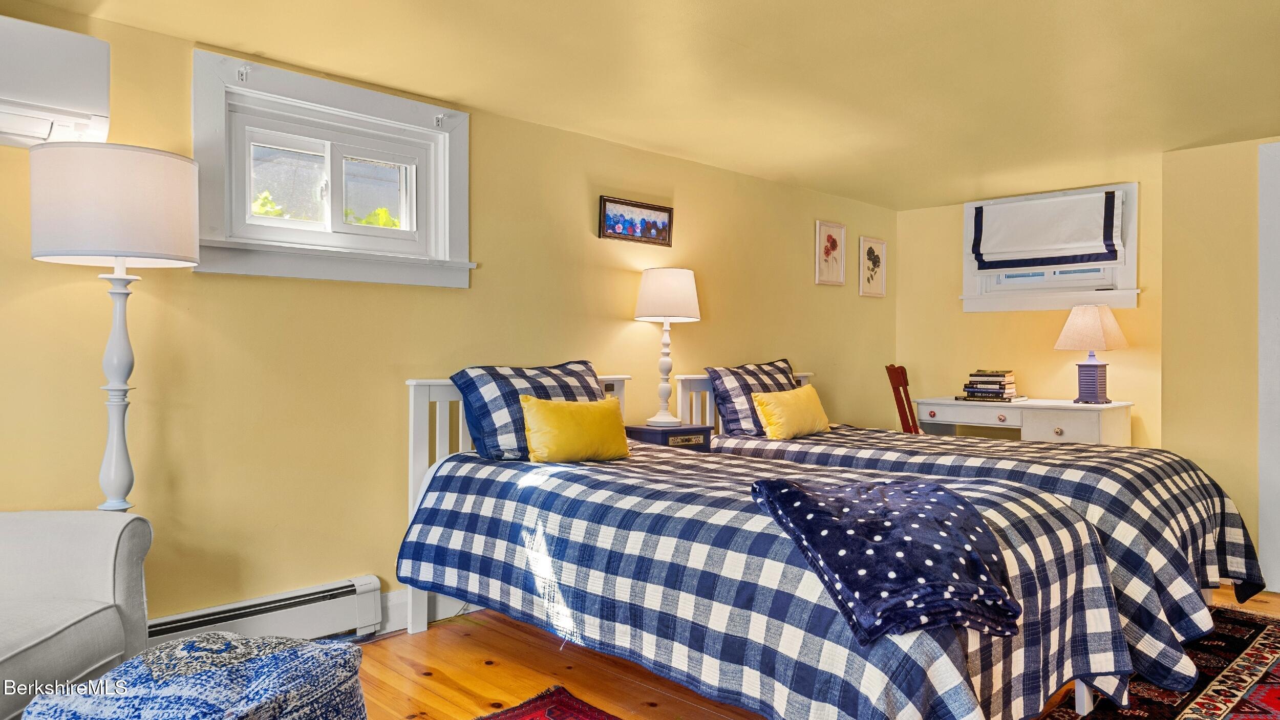 7 Lake Buel Road Great Barrington, MA 01230 - Photo 27 of 42 a bedroom with a bed and wooden floor