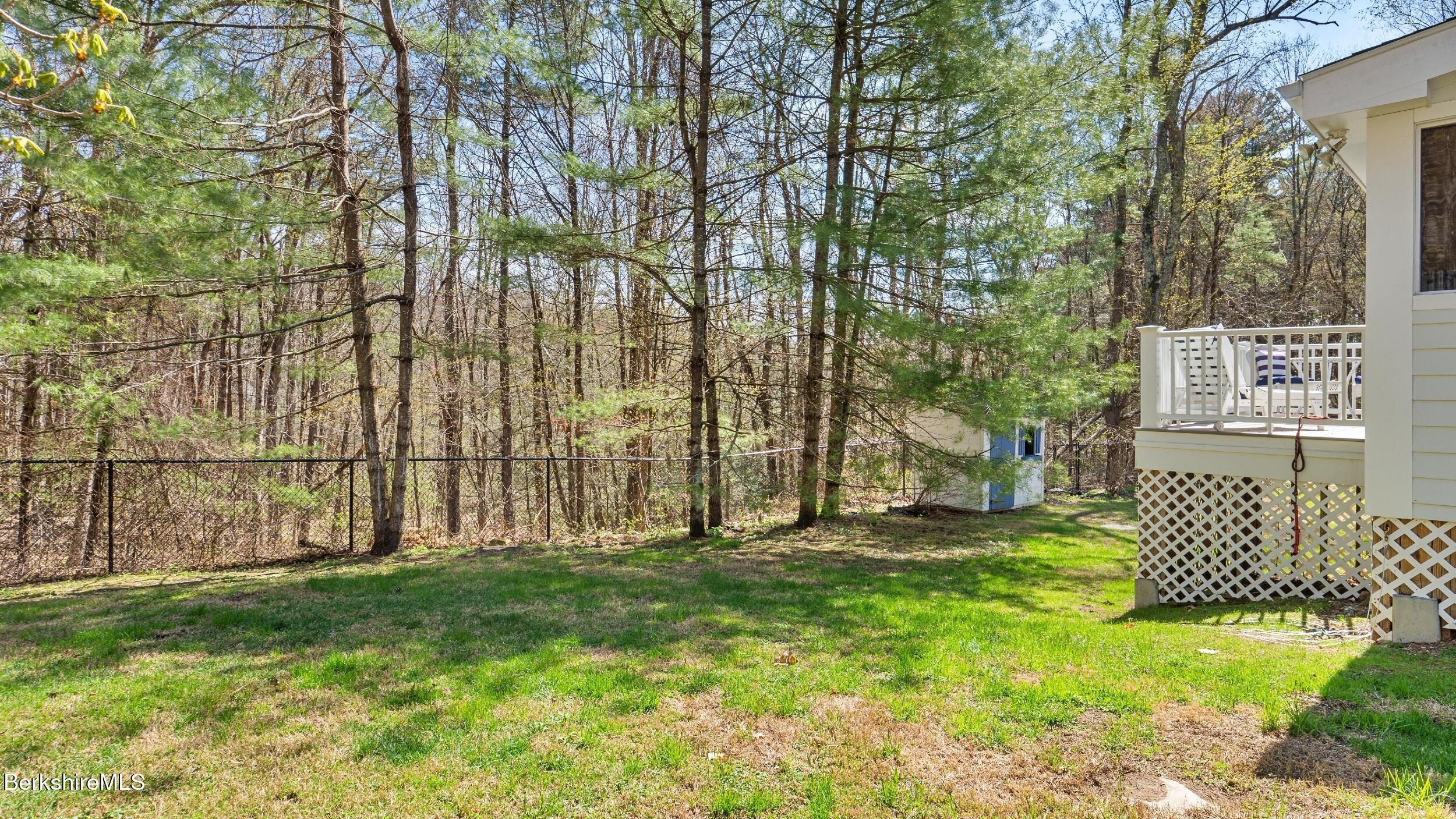 7 Lake Buel Road Great Barrington, MA 01230 - Photo 35 of 42 a row of trees with wooden fence