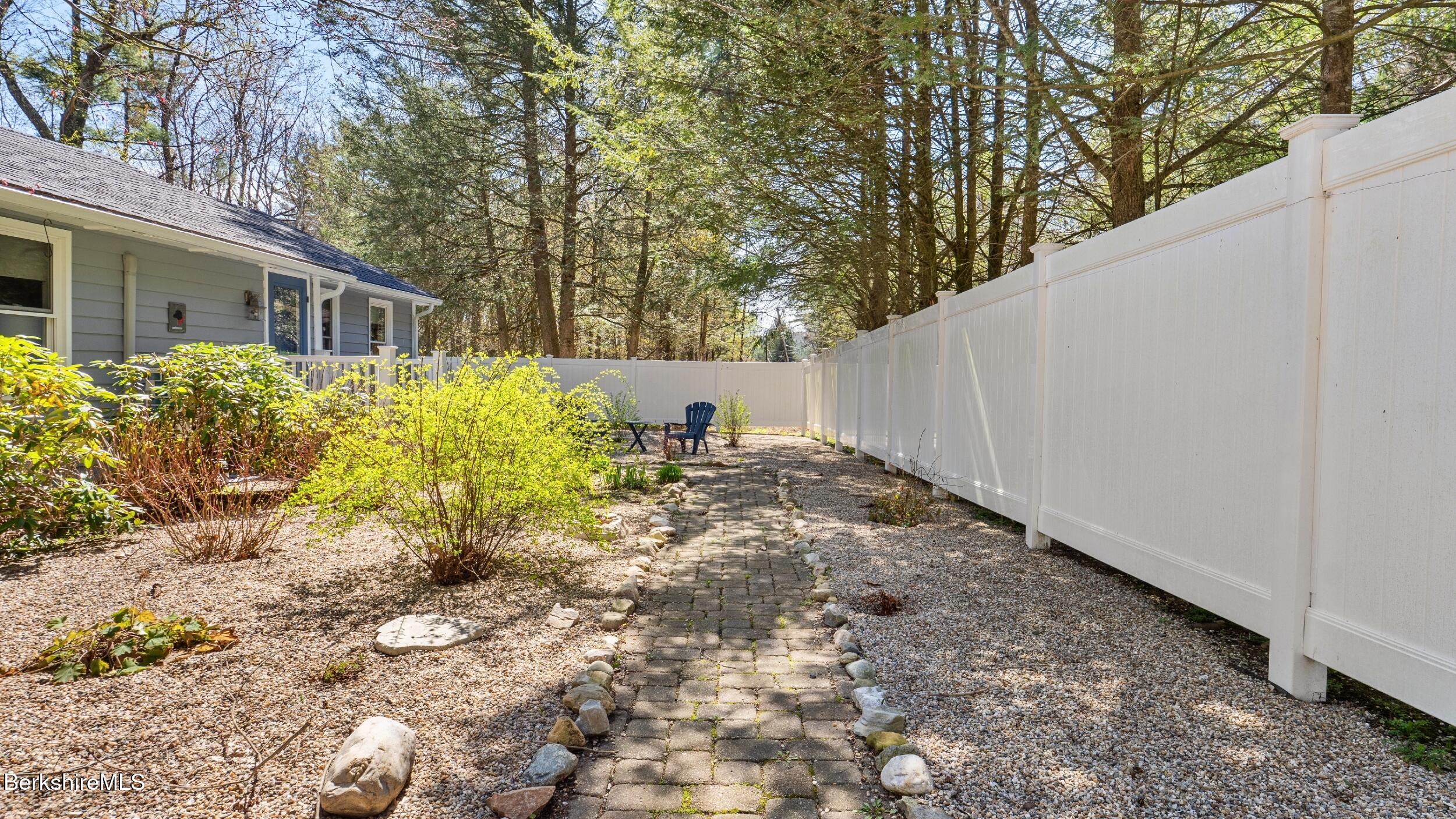 7 Lake Buel Road Great Barrington, MA 01230 - Photo 36 of 42 a view of a yard with plants and trees