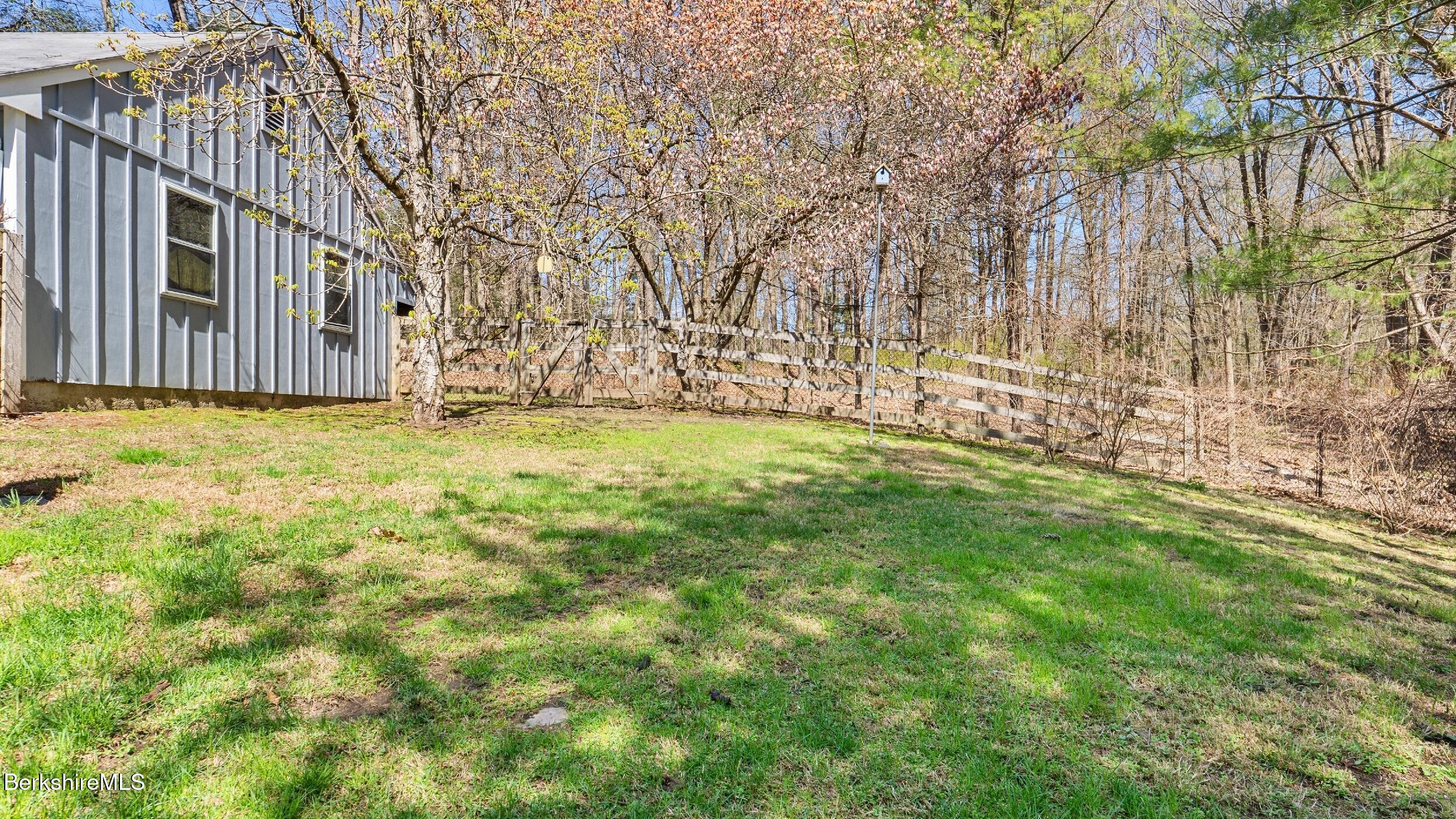 7 Lake Buel Road Great Barrington, MA 01230 - Photo 37 of 42 a view of a backyard with large trees