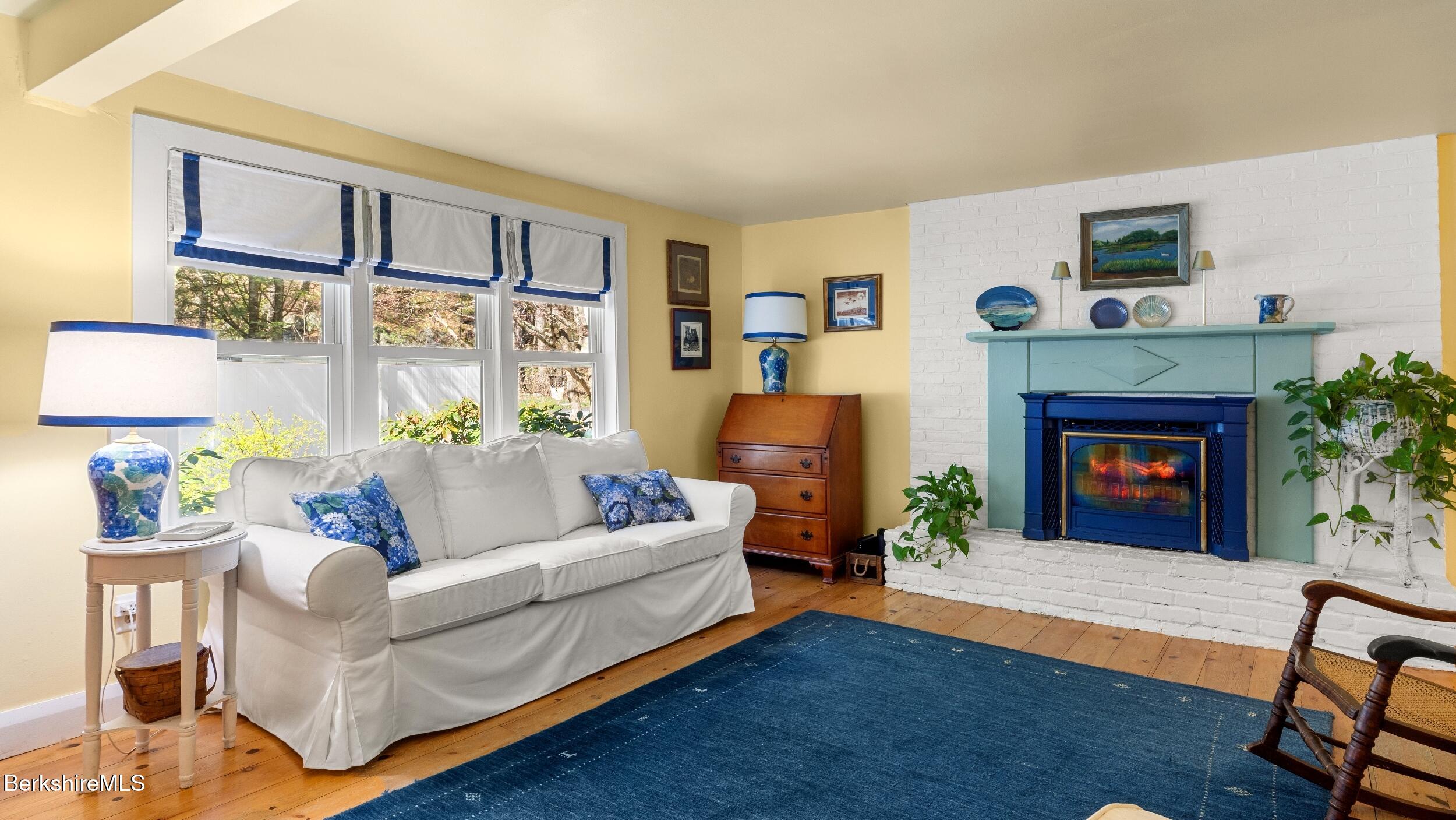 7 Lake Buel Road Great Barrington, MA 01230 - Photo 8 of 42 a living room with furniture and a fireplace
