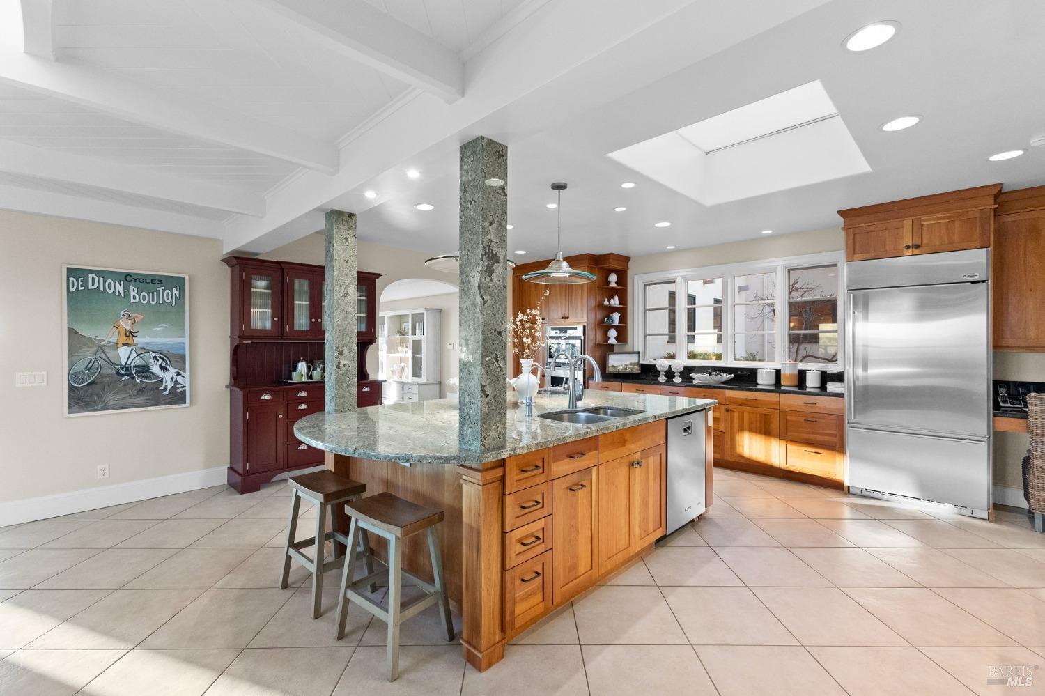 4680 Acacia Lane Penngrove, CA 94951 - Photo 12 of 83 a kitchen with kitchen island granite countertop lots of counter top space and stainless steel appliances