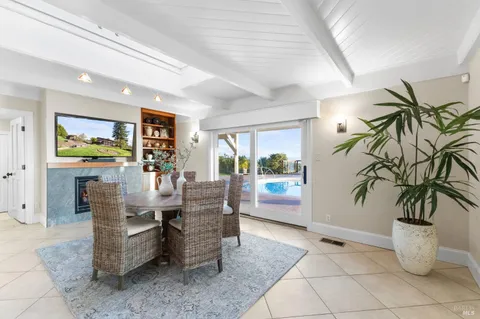 a living room with couch and a view of kitchen