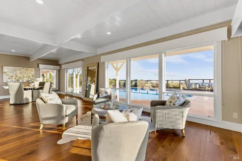 a view of a very nice looking dining room with chandelier