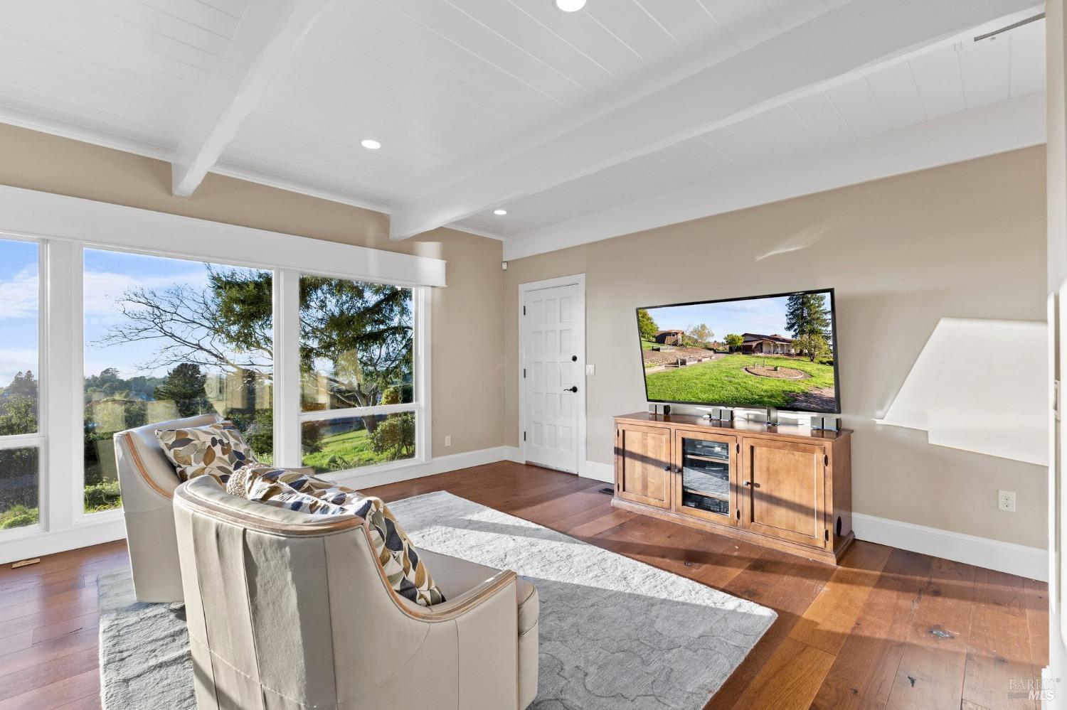 4680 Acacia Lane Penngrove, CA 94951 - Photo 23 of 83 a living room with furniture and a flat screen tv