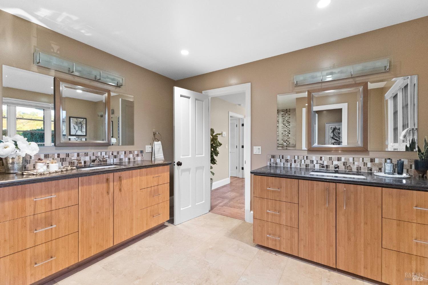 4680 Acacia Lane Penngrove, CA 94951 - Photo 29 of 83 a bathroom with a granite countertop sink and a mirror