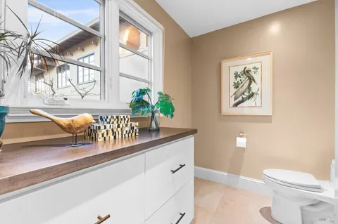 a view of a bathroom with a shower and a toilet