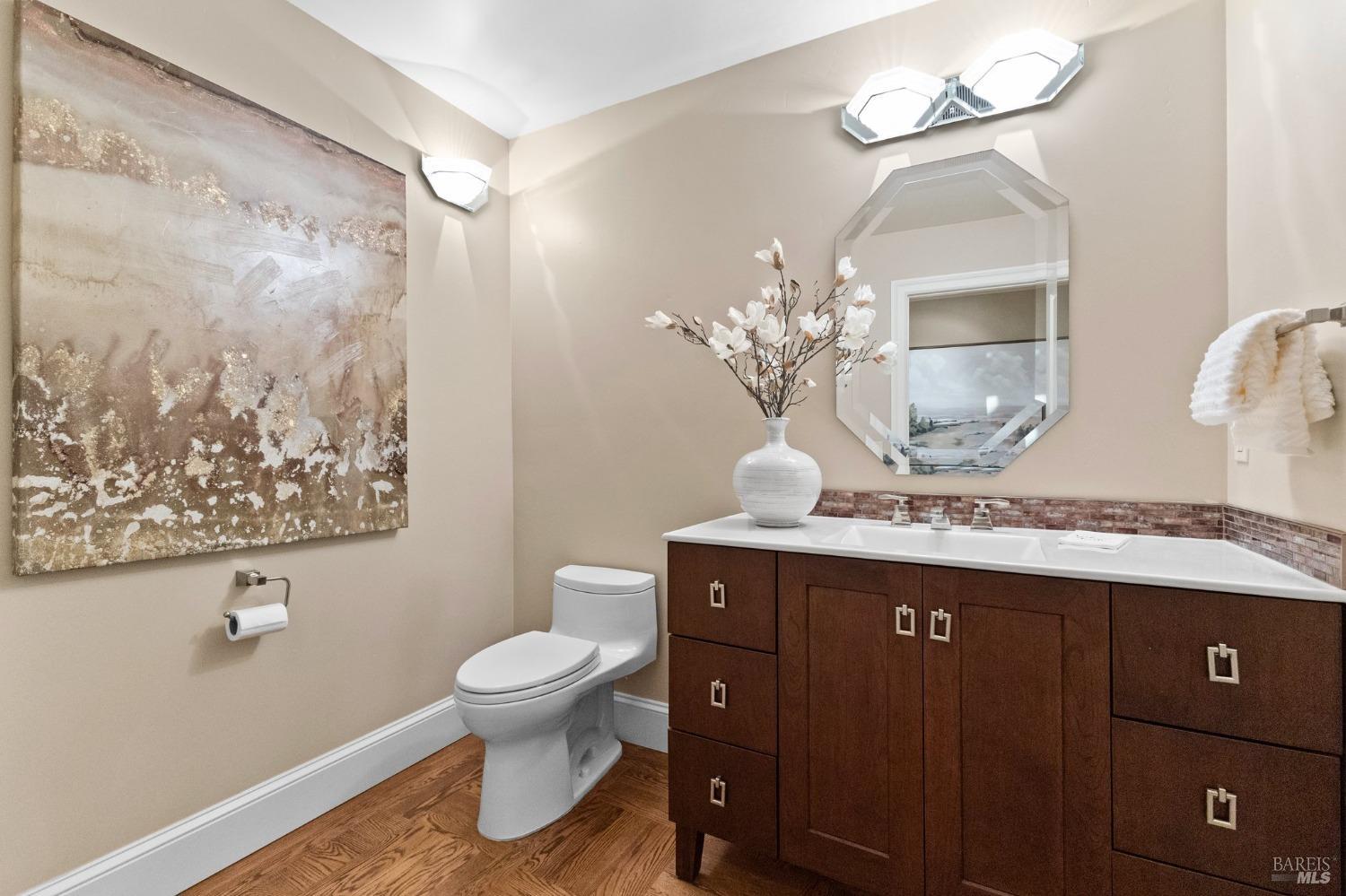 4680 Acacia Lane Penngrove, CA 94951 - Photo 39 of 83 a spacious bathroom with a granite countertop sink a toilet and a mirror