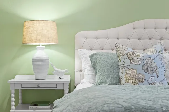 a bathroom with a granite countertop sink a toilet a mirror and shower