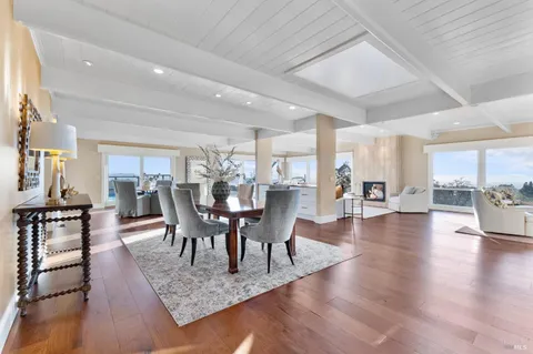 a kitchen with granite countertop a stove and a white cabinet