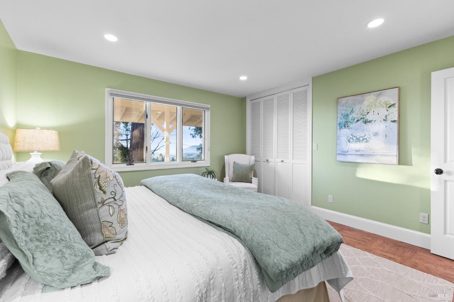 4680 Acacia Lane Penngrove, CA 94951 - Photo 42 of 83 a bedroom with a bed and a painting on the wall