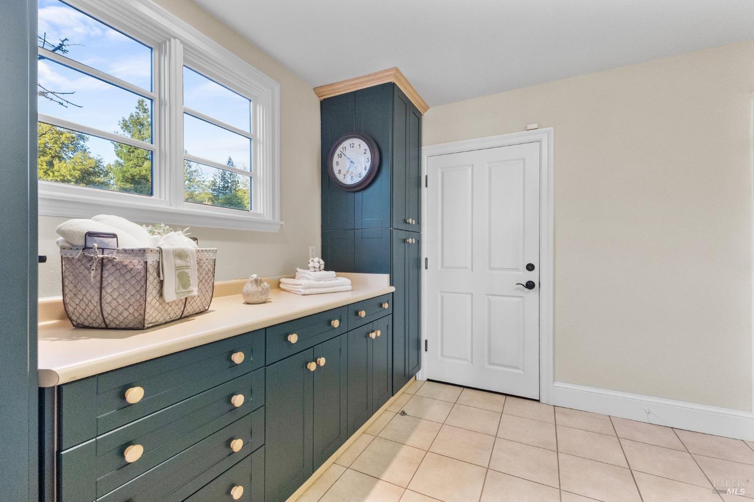 4680 Acacia Lane Penngrove, CA 94951 - Photo 46 of 83 a bathroom with a double vanity sink and a mirror
