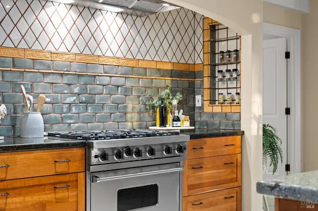 a living room with furniture and a mirror