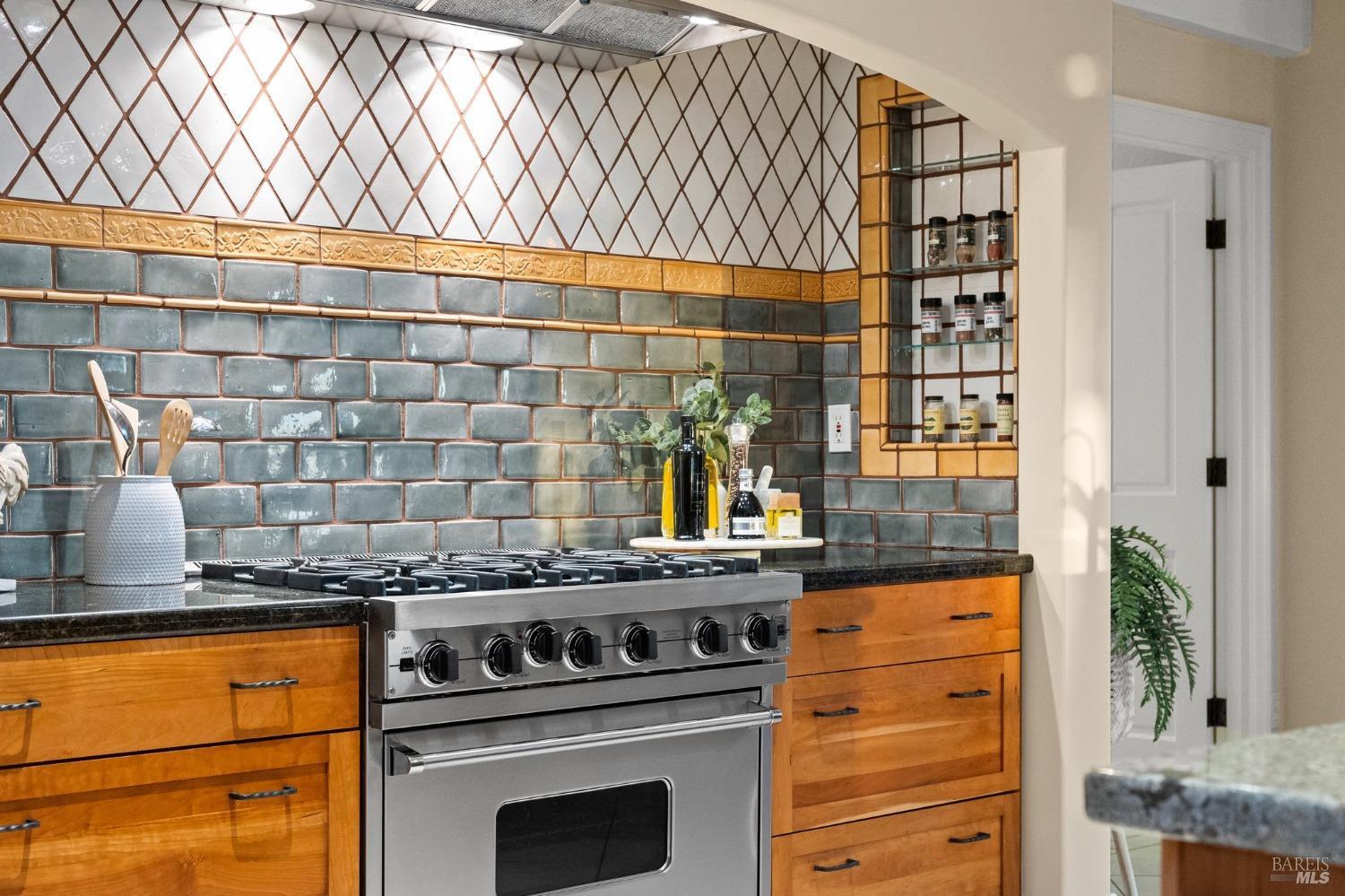 4680 Acacia Lane Penngrove, CA 94951 - Photo 6 of 83 a kitchen with granite countertop a stove and a white cabinet