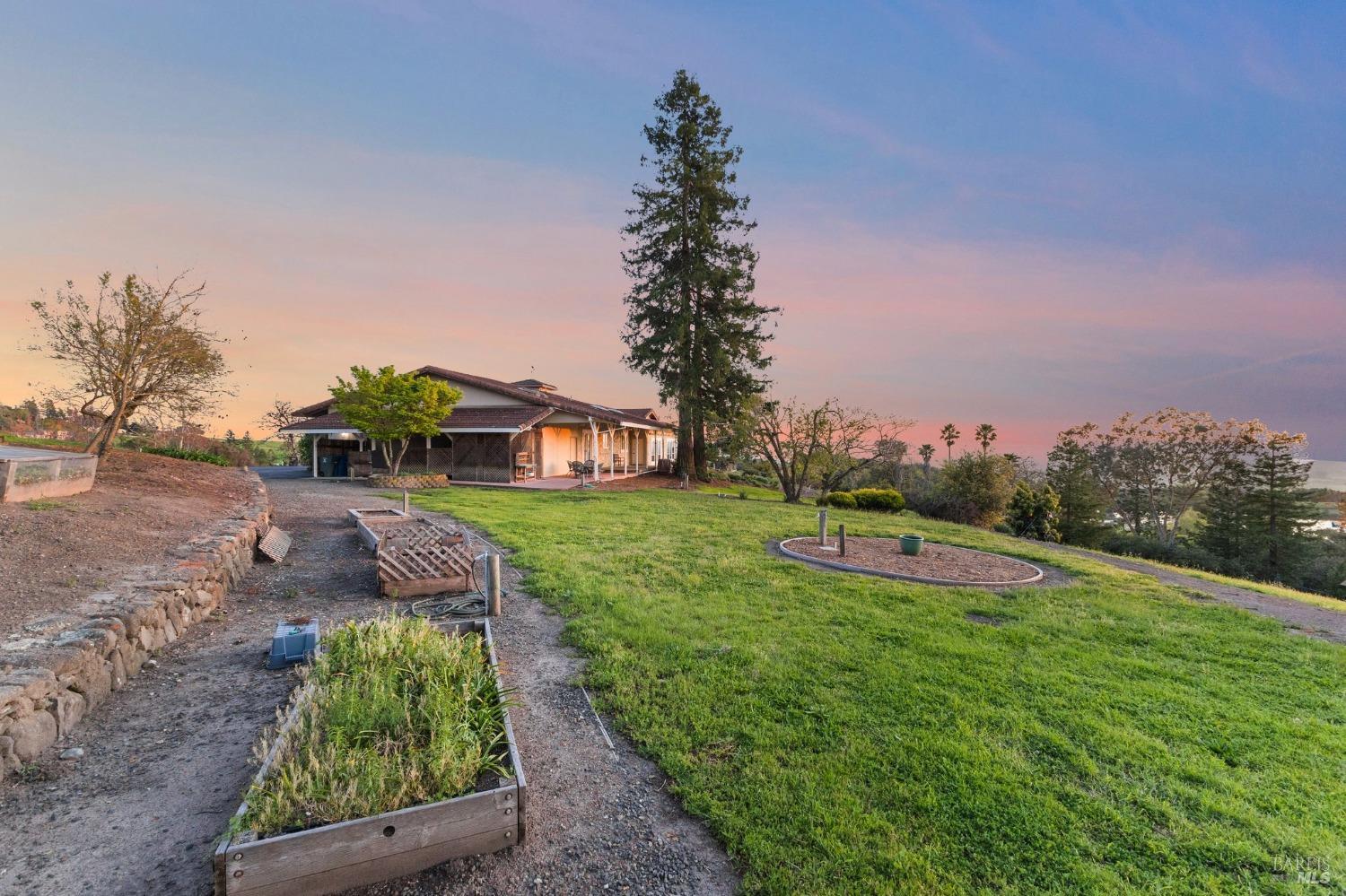 4680 Acacia Lane Penngrove, CA 94951 - Photo 70 of 83 a view of an house with backyard space and a lake view