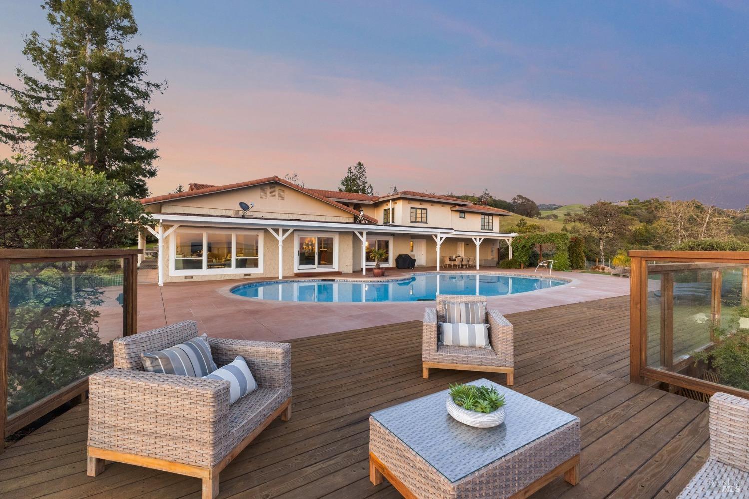 4680 Acacia Lane Penngrove, CA 94951 - Photo 7 of 83 a view of a patio with couches table and chairs with wooden floor and fence